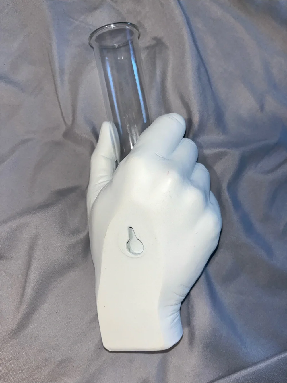 White Hand Vase Holding Clear Glass Tube